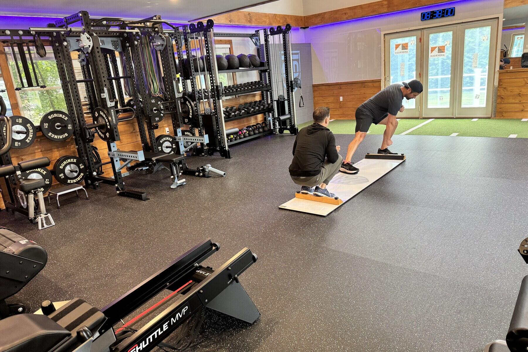 Coached slideboard training session on the main floor