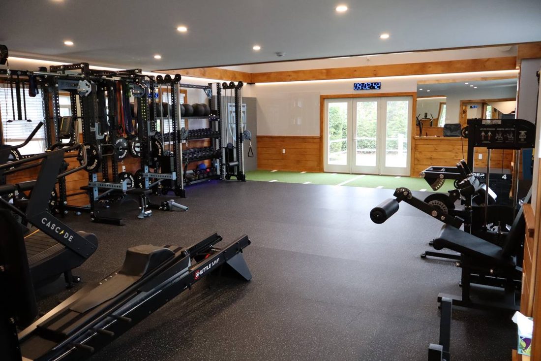 PT Progression's strength and conditioning floor, racks and turf under one roof