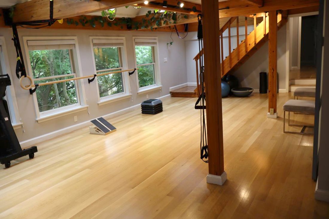 Movement studio with barre and open floor